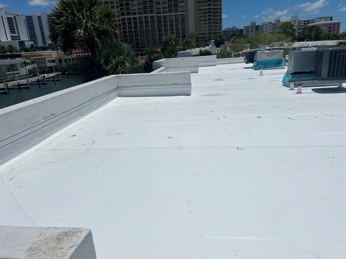 White flat roof membrane on a commercial building near the Sarasota waterfront