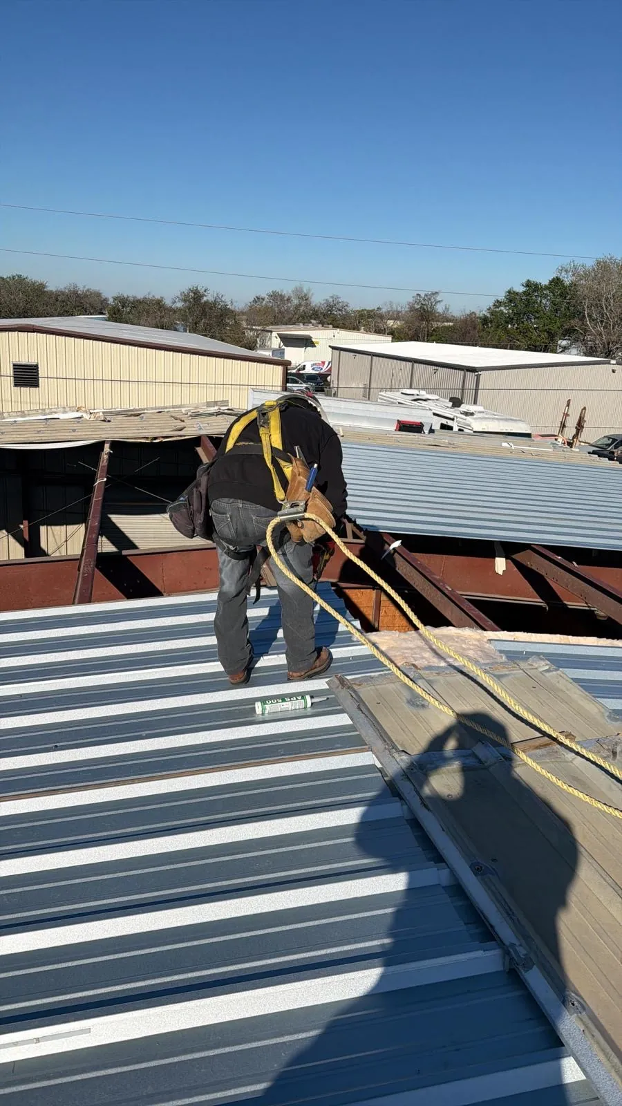 SRQ crew installing an industrial flat roof system in Sarasota, FL