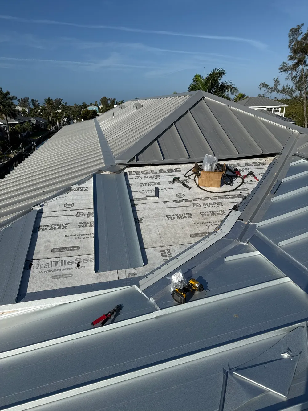 Metal roof repair work performed by SRQ Building Services in Sarasota, FL