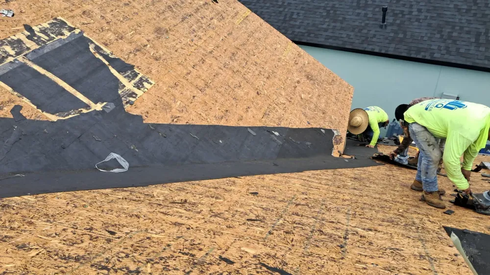 SRQ Building Services documenting maintenance findings on a Sarasota roof