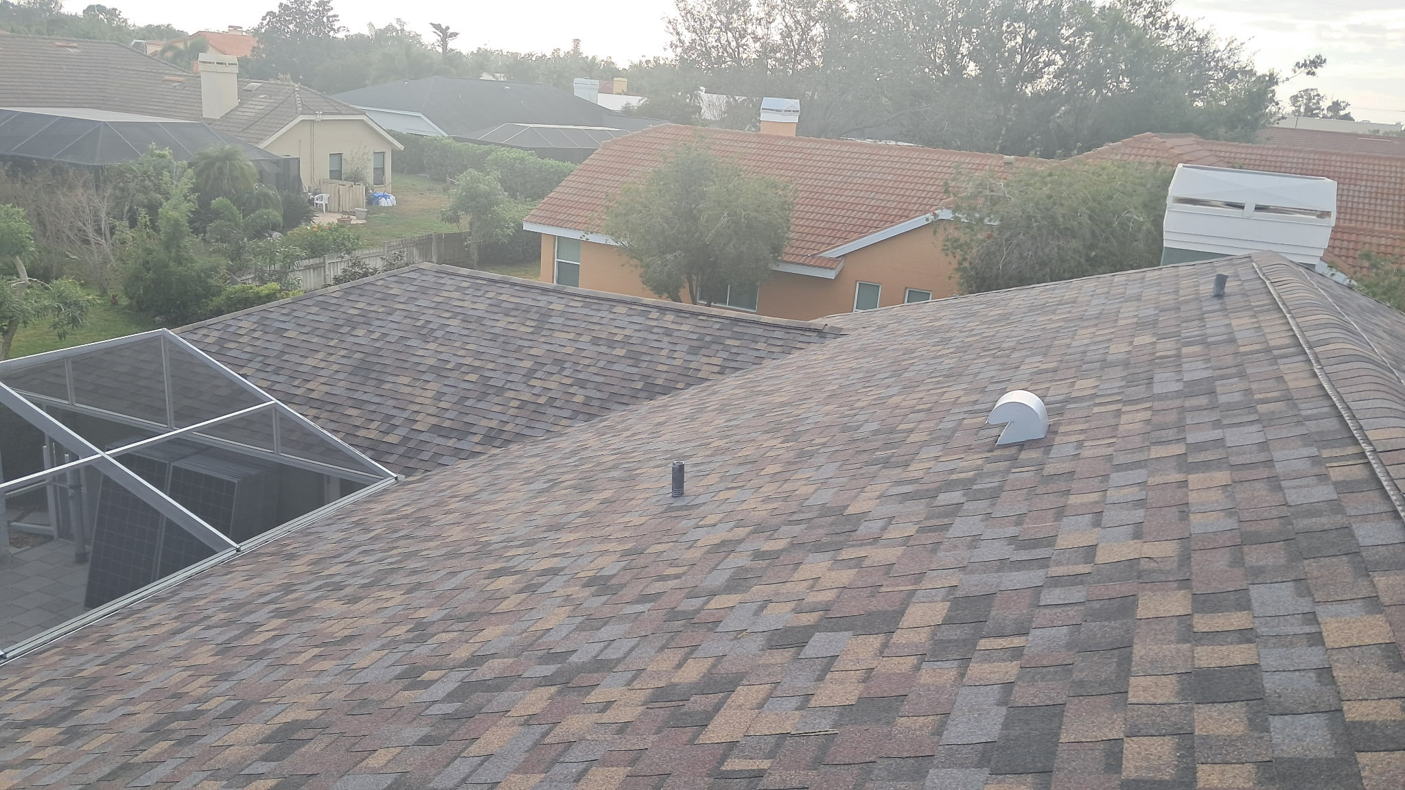 Architectural shingle roof replacement in progress in Sarasota, FL